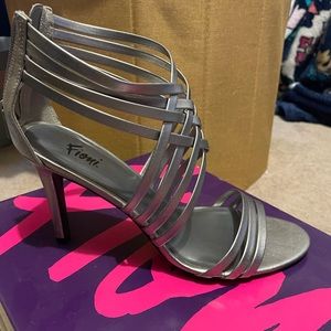 Strappy, metallic silver heel, zippered back